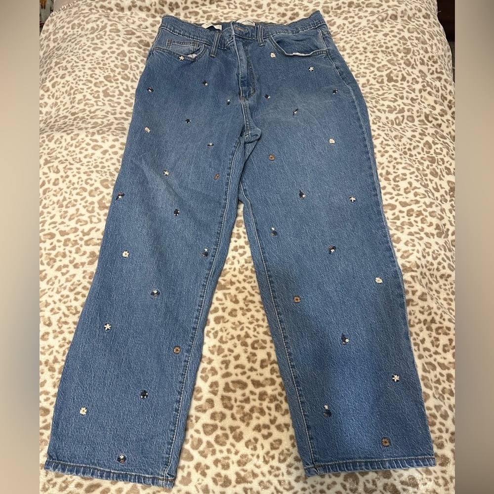 Vintage thread jeans with flowers stitched on them!